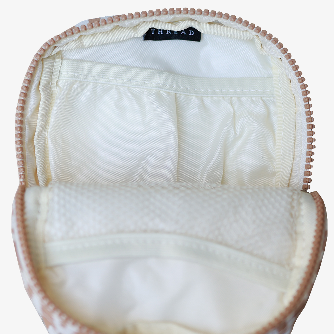 Inside of the Thread¨ Mozi crossbody bag showing pockets and printed lining