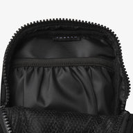 Inside of the Thread® Black crossbody bag showing pockets and printed lining