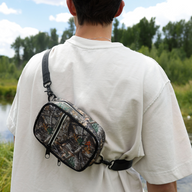 Person wearing the Thread¨ Realtree Edge crossbody bag across the chest